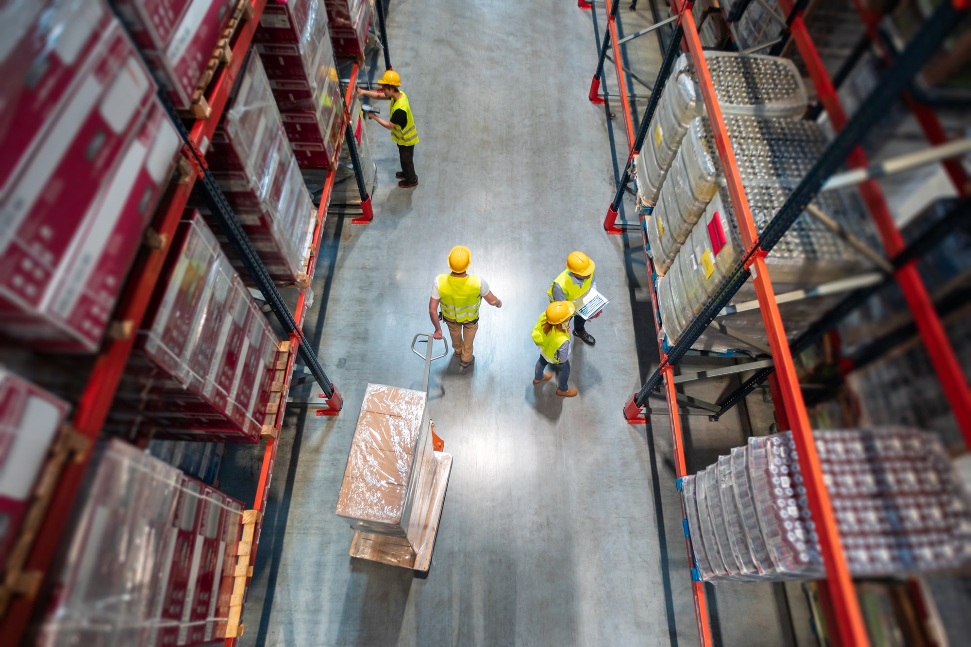 GE_Logistics_working-in-warehouse-group-of-workers-with-laptop-2021-08-29-22-34-01-utc-min