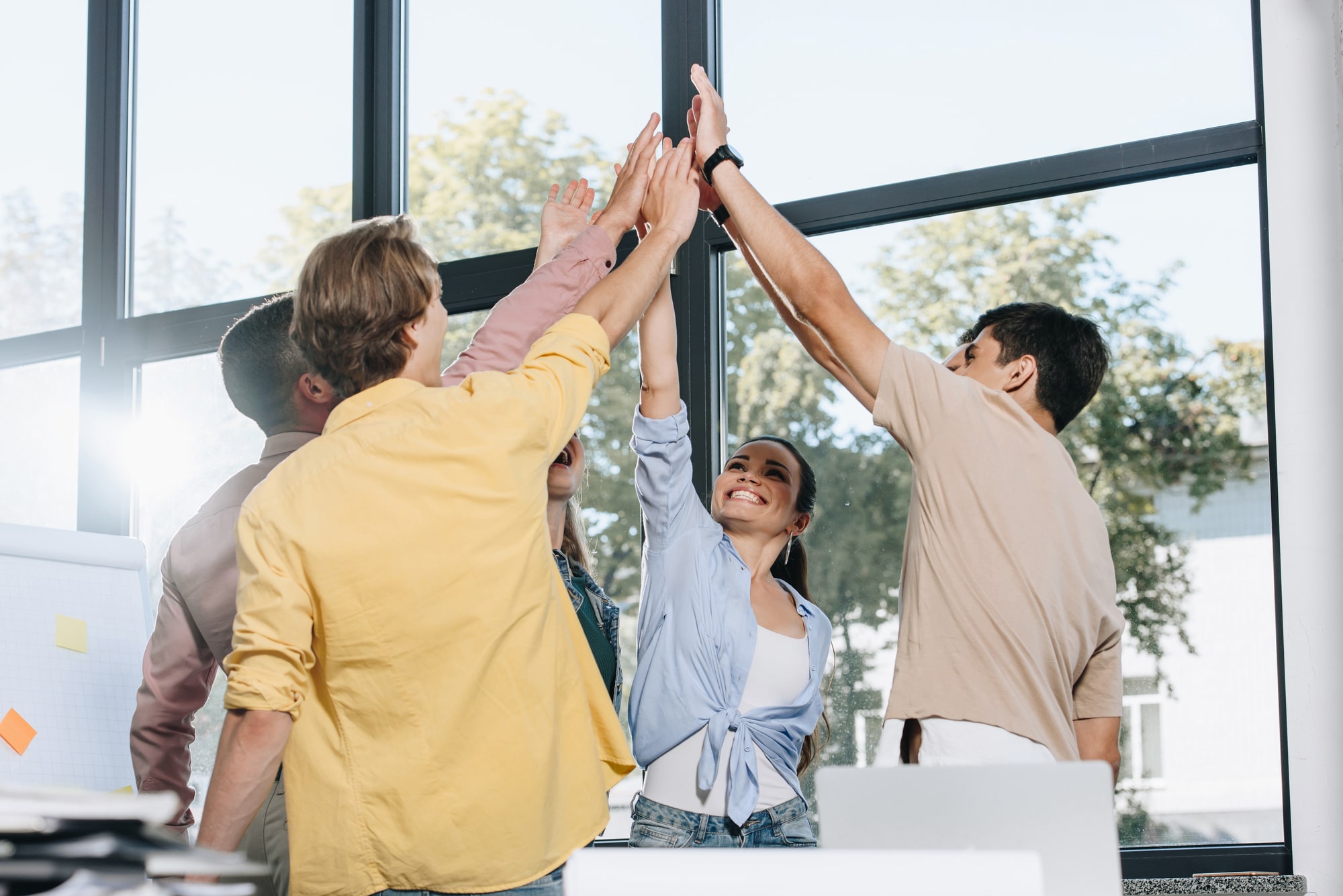 Growth Era_About us_2_happy-businesspeople-celebrating-success-and-givin-2022-12-16-16-23-35-utc-min